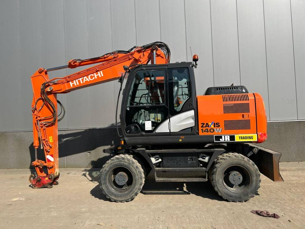 Hitachi ZX 140 W-5B - Pelle sur pneus: photos 1 Hitachi ZX 140 W-5B - Pelle sur pneus: photos 1