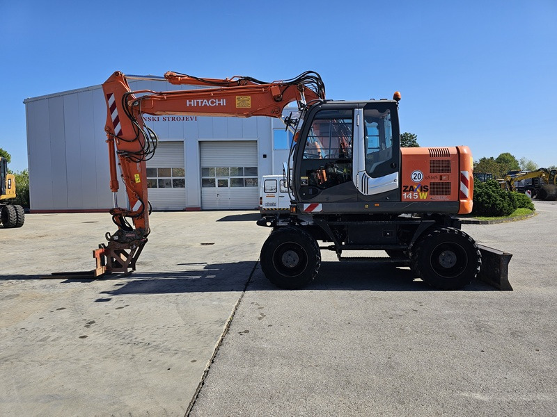 HITACHI ZX145W-3 - Pelle sur pneus: photos 1 HITACHI ZX145W-3 - Pelle sur pneus: photos 1