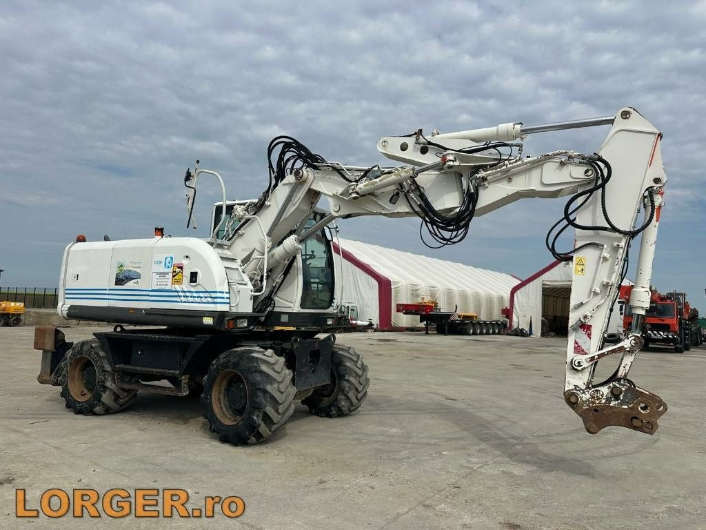 Hitachi ZX 140 W-3 - Pelle sur pneus: photos 1 Hitachi ZX 140 W-3 - Pelle sur pneus: photos 1