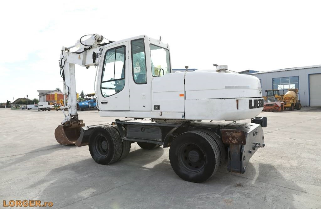 Liebherr A 316 Litronic - Pelle sur pneus: photos 2 Liebherr A 316 Litronic - Pelle sur pneus: photos 2