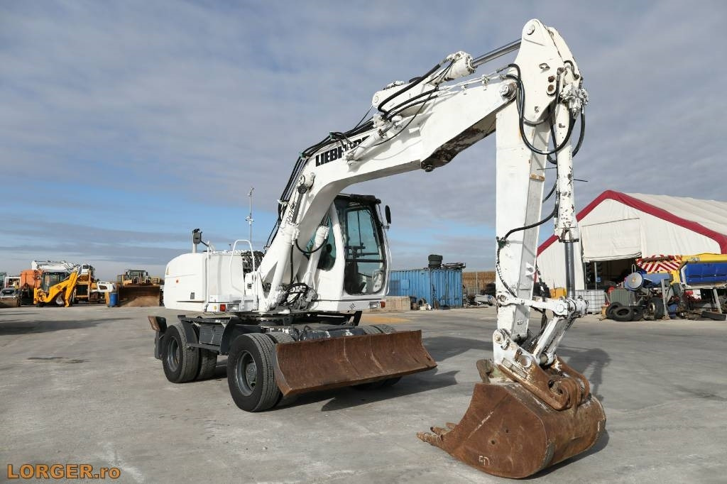 Liebherr A 316 Litronic - Pelle sur pneus: photos 4 Liebherr A 316 Litronic - Pelle sur pneus: photos 4