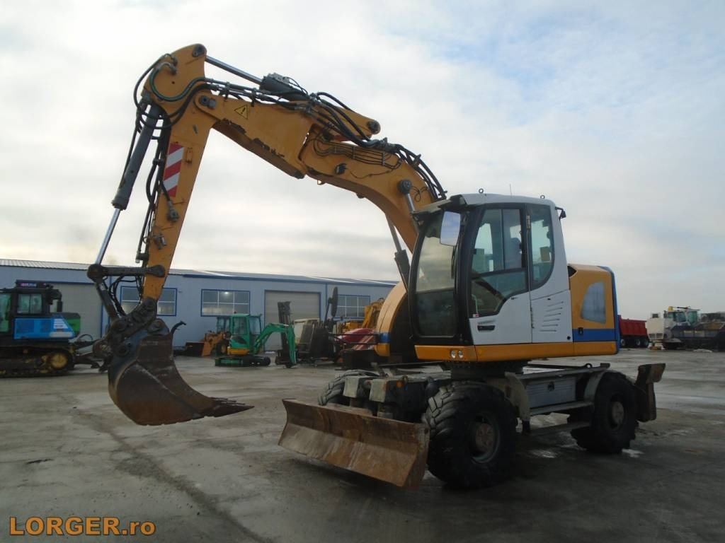 Liebherr A 914 Compact - Pelle sur pneus: photos 1 Liebherr A 914 Compact - Pelle sur pneus: photos 1