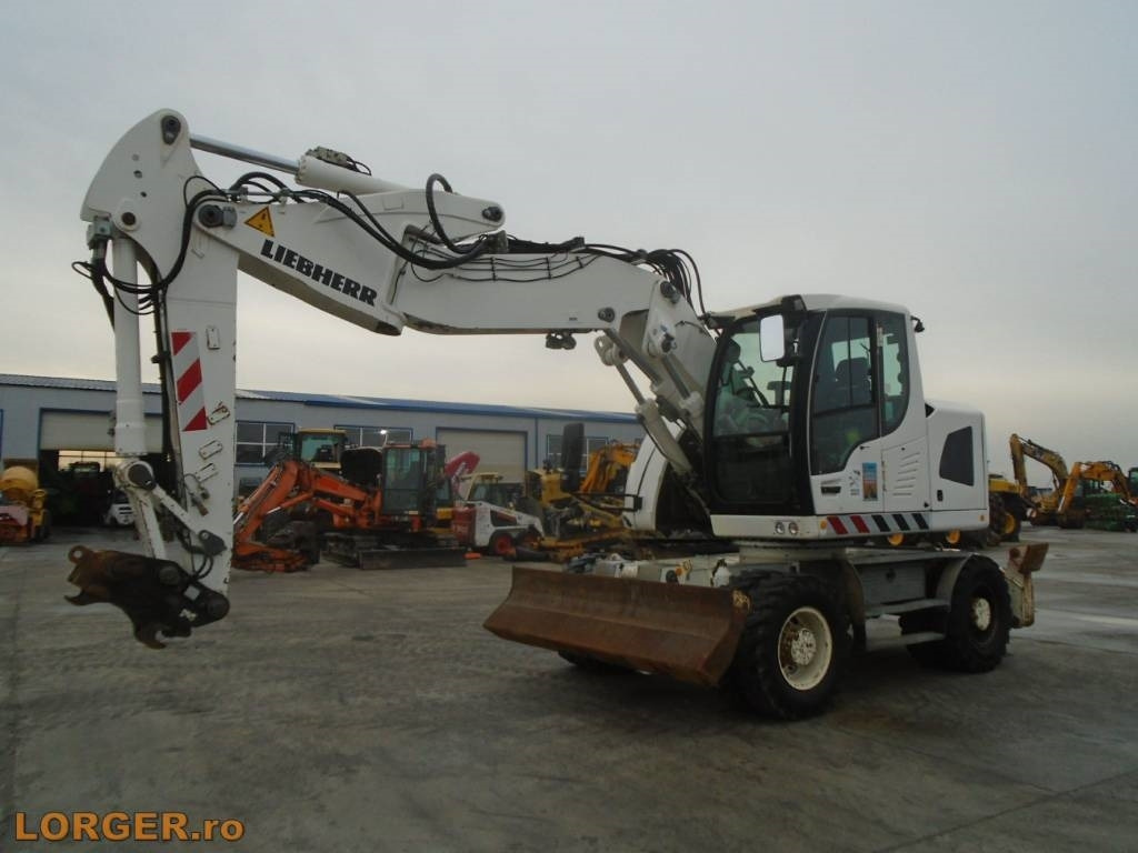 Liebherr A 918 Compact - Pelle sur pneus: photos 1 Liebherr A 918 Compact - Pelle sur pneus: photos 1