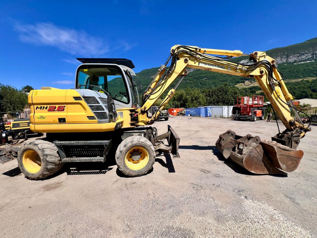 New Holland MH 2.6 PELLE A PNEUS 10T - Pelle sur pneus: photos 5 New Holland MH 2.6 PELLE A PNEUS 10T - Pelle sur pneus: photos 5