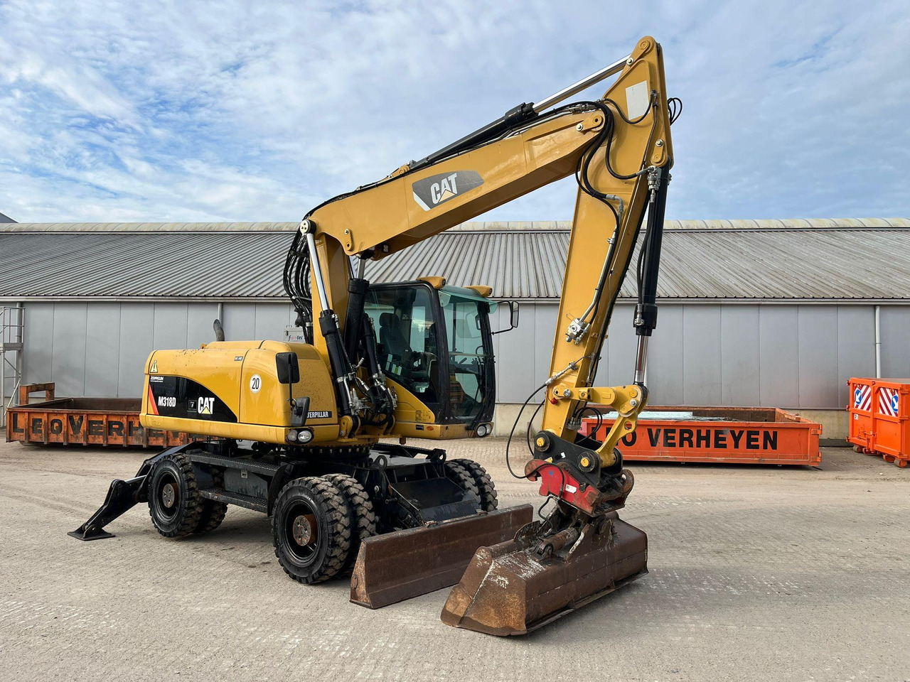 Caterpillar M318D - Pelle sur pneus: photos 1 Caterpillar M318D - Pelle sur pneus: photos 1