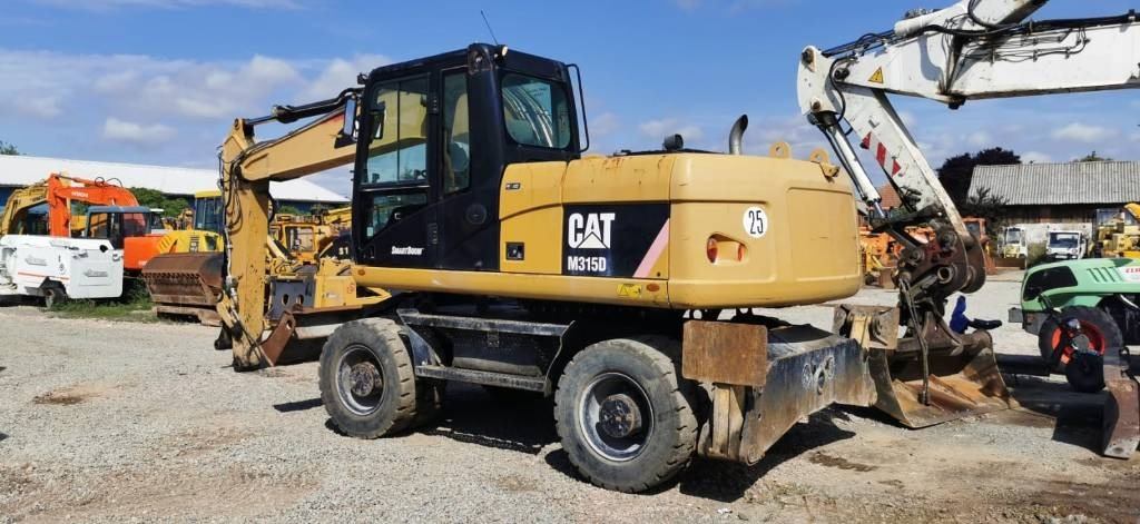 CAT M 315 D - Pelle sur pneus: photos 5 CAT M 315 D - Pelle sur pneus: photos 5
