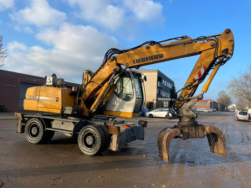 Liebherr A 316 - Pelle sur pneus: photos 4 Liebherr A 316 - Pelle sur pneus: photos 4