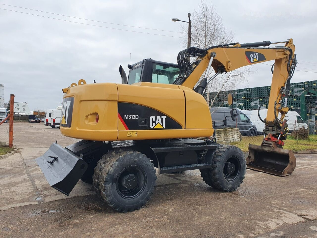Pelle sur pneus Caterpillar M 313 D Tiltrotator: photos 8