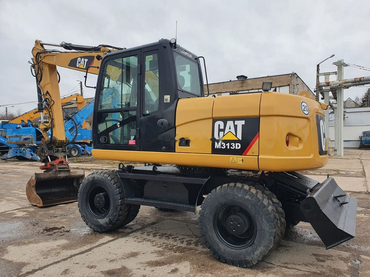 Pelle sur pneus Caterpillar M 313 D Tiltrotator: photos 12