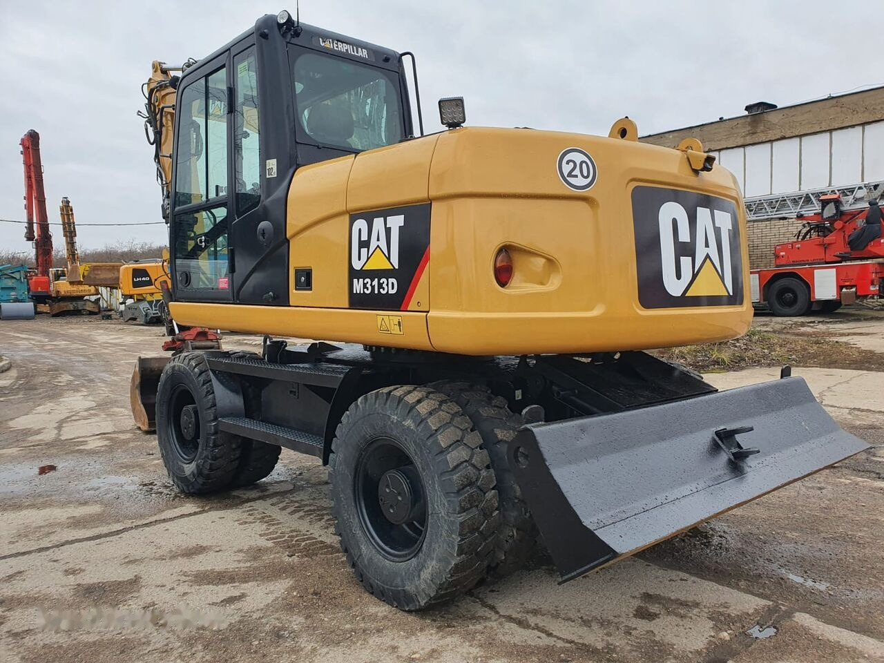 Pelle sur pneus Caterpillar M 313 D Tiltrotator: photos 11