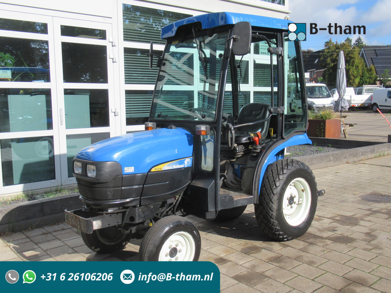 New Holland TC21D 4WD 4x4 Cabine Verwarming - Tracteur agricole: photos 1 New Holland TC21D 4WD 4x4 Cabine Verwarming - Tracteur agricole: photos 1