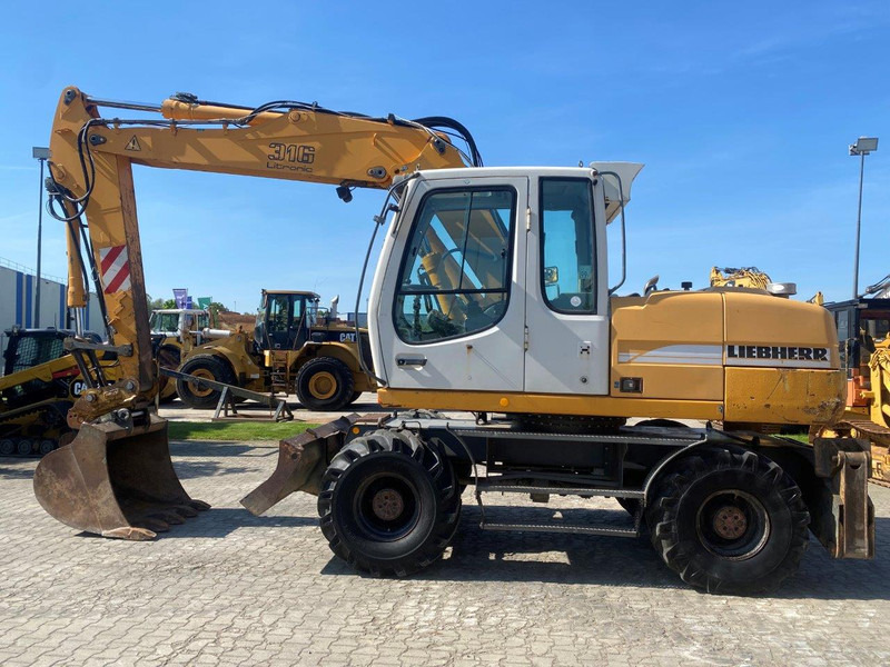 Liebherr A316 Litronic NVT - Pelle sur pneus: photos 2 Liebherr A316 Litronic NVT - Pelle sur pneus: photos 2
