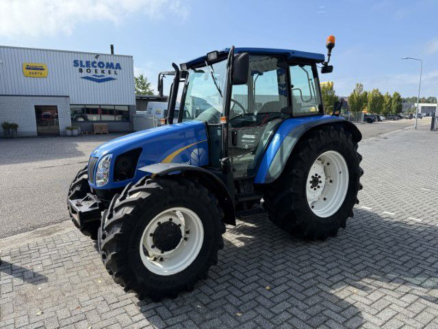 New Holland TL90A 4WD - Tracteur agricole: photos 1 New Holland TL90A 4WD - Tracteur agricole: photos 1