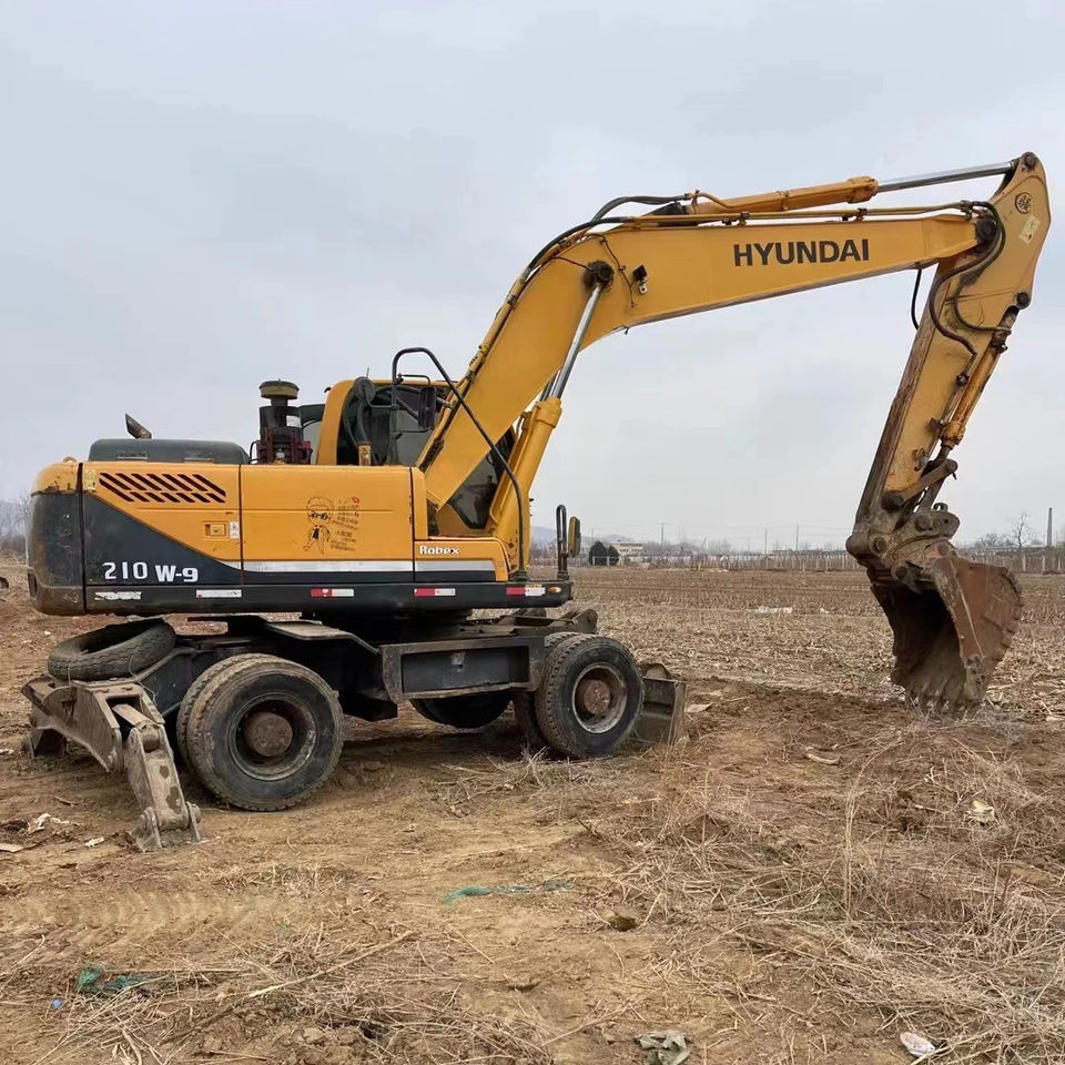 Original Good Quality USED Excavators R210 W-9T 21 Ton Excavator Wheel Excavator for HYUNDAI - Pelle sur pneus: photos 1 Original Good Quality USED Excavators R210 W-9T 21 Ton Excavator Wheel Excavator for HYUNDAI - Pelle sur pneus: photos 1