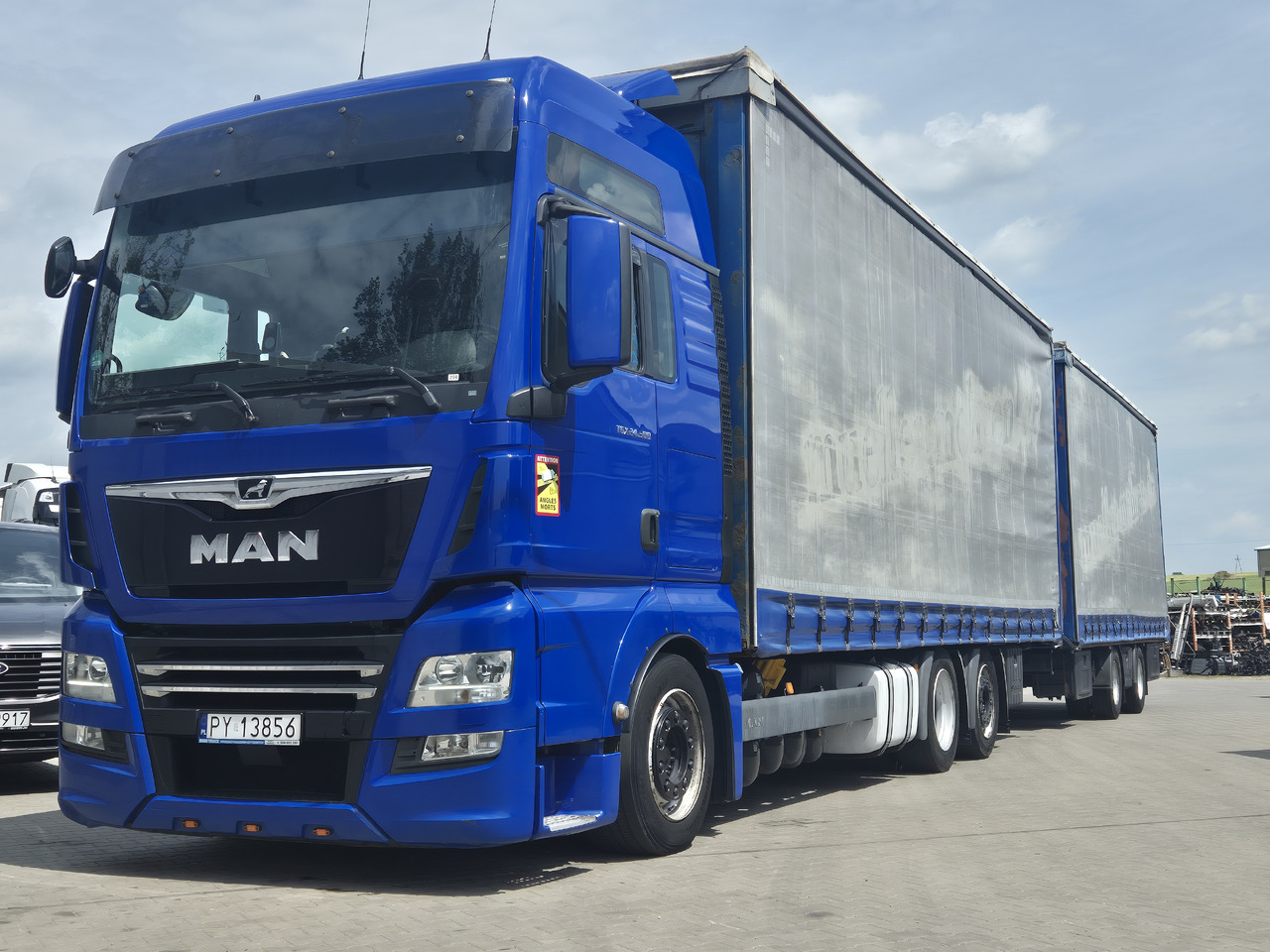 MAN tgx 24,500 - Camion à rideaux coulissants: photos 1 MAN tgx 24,500 - Camion à rideaux coulissants: photos 1