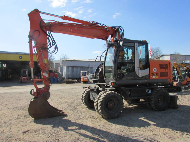 Hitachi ZX 140 W-3 Mobilbagger 45.000 EUR / Klima - Pelle sur pneus: photos 1 Hitachi ZX 140 W-3 Mobilbagger 45.000 EUR / Klima - Pelle sur pneus: photos 1