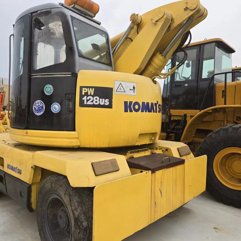 KOMATSU PC128US - Pelle sur pneus: photos 4 KOMATSU PC128US - Pelle sur pneus: photos 4