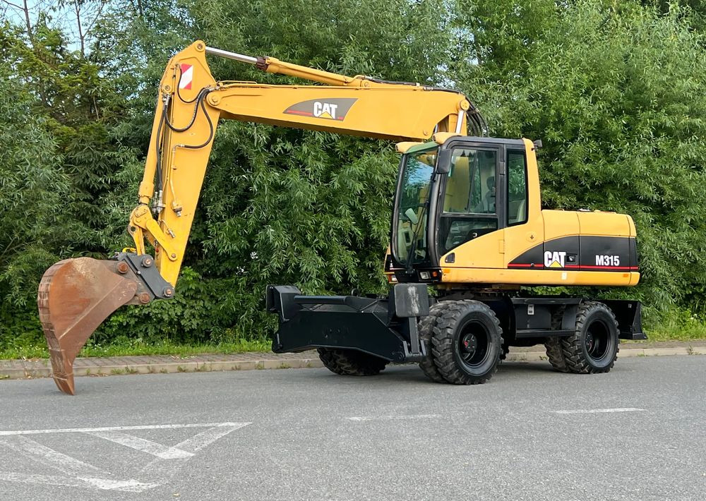 Caterpillar CAT M315C CATERPILLAR SPROWADZONY Bardzo Dobry Stan - Pelle sur pneus: photos 1 Caterpillar CAT M315C CATERPILLAR SPROWADZONY Bardzo Dobry Stan - Pelle sur pneus: photos 1