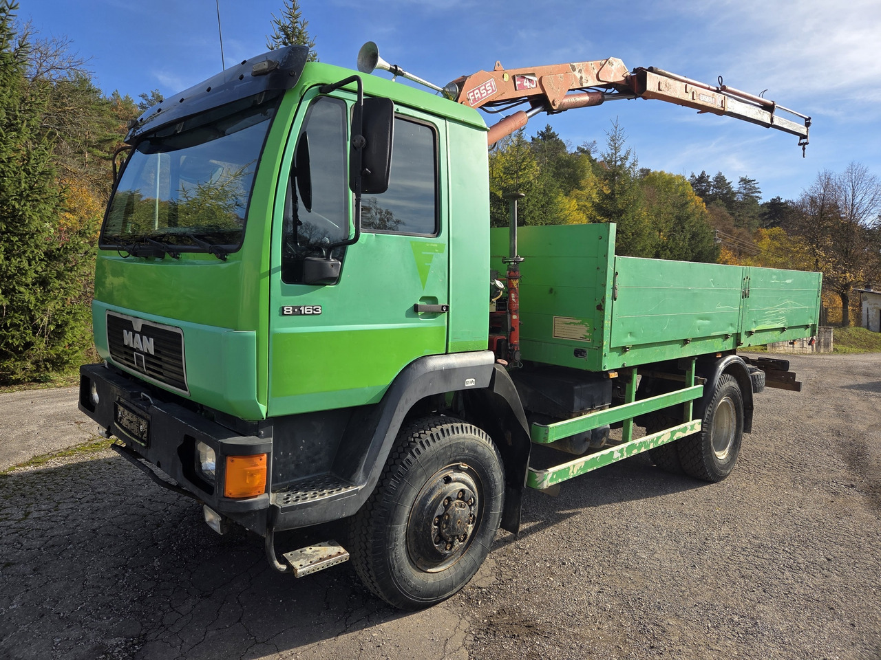 MAN 8.163 4x4 + crane FASSI F45A.22 - Camion plateau: photos 1 MAN 8.163 4x4 + crane FASSI F45A.22 - Camion plateau: photos 1