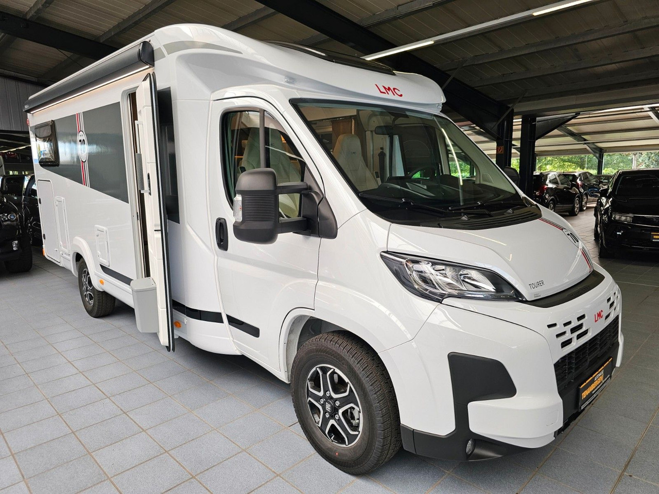 LMC Tourer T660G 70 Jahre AT-8 WC Markise Navi - Camping-car profilé: photos 1 LMC Tourer T660G 70 Jahre AT-8 WC Markise Navi - Camping-car profilé: photos 1