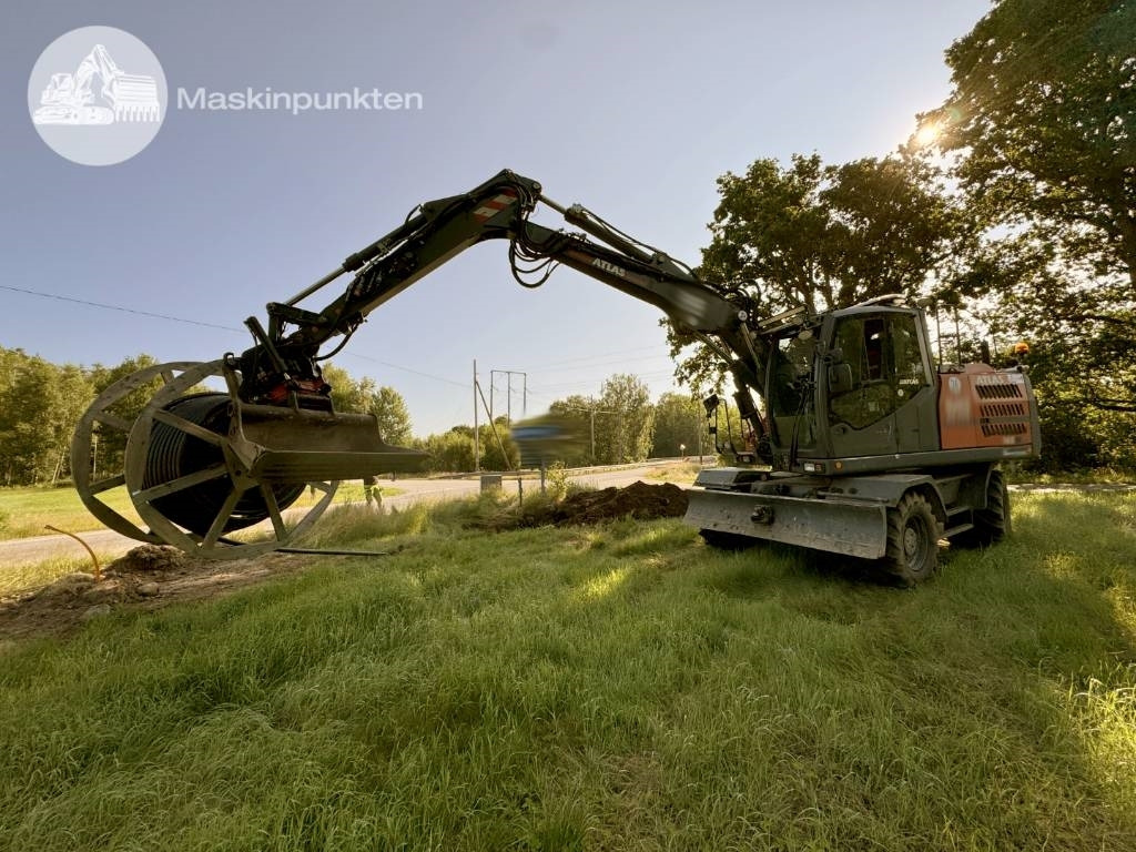 Atlas 160 W - Pelle sur pneus: photos 1 Atlas 160 W - Pelle sur pneus: photos 1
