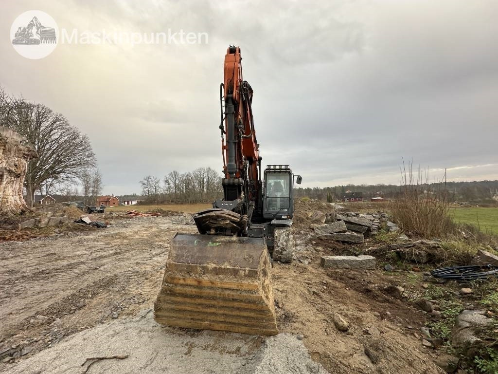 Doosan DX 140 W - Pelle sur pneus: photos 2 Doosan DX 140 W - Pelle sur pneus: photos 2