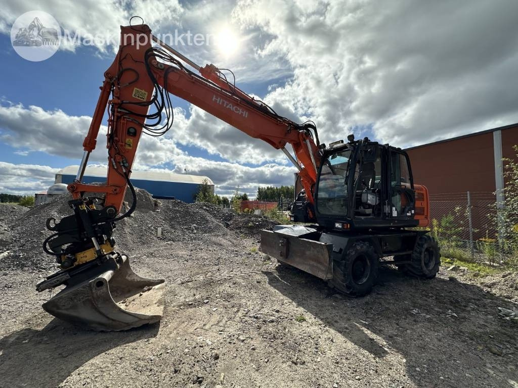 Hitachi ZX 140 W-5B - Pelle sur pneus: photos 1 Hitachi ZX 140 W-5B - Pelle sur pneus: photos 1