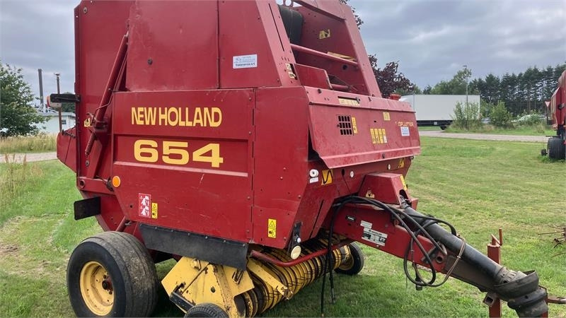 New Holland 654 RUNDBALLEPRESSER Cropcutter - Presse à balles rondes: photos 1 New Holland 654 RUNDBALLEPRESSER Cropcutter - Presse à balles rondes: photos 1