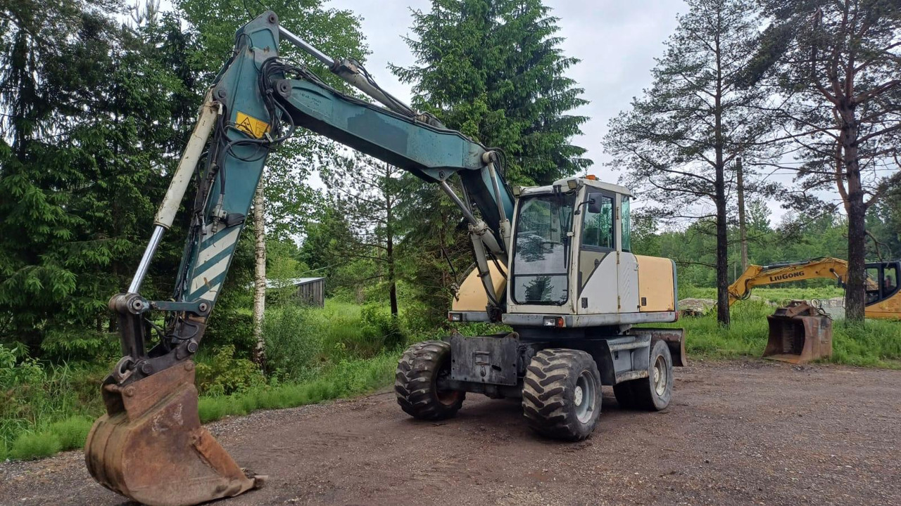 Volvo EW140 - Pelle sur pneus: photos 1 Volvo EW140 - Pelle sur pneus: photos 1