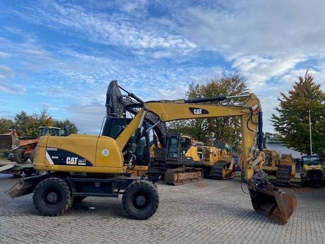 Cat M 313 D MIETE / RENTAL (12005587) - Pelle sur pneus: photos 5 Cat M 313 D MIETE / RENTAL (12005587) - Pelle sur pneus: photos 5