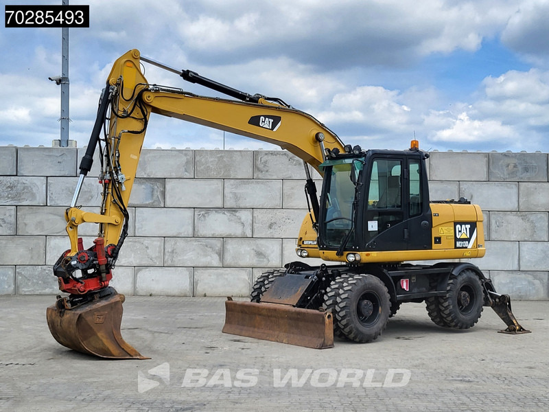 Caterpillar M313 D OUTRIGGERS + ROTOTILT - Pelle sur pneus: photos 2 Caterpillar M313 D OUTRIGGERS + ROTOTILT - Pelle sur pneus: photos 2