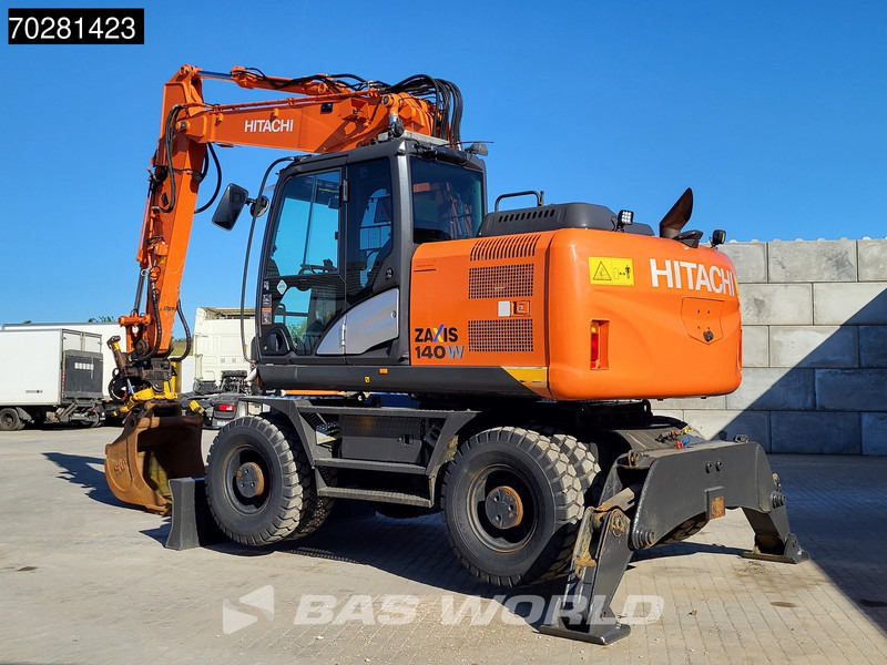 Hitachi ZX140W -5 OUTRIGGERS + BLADE - Pelle sur pneus: photos 3 Hitachi ZX140W -5 OUTRIGGERS + BLADE - Pelle sur pneus: photos 3