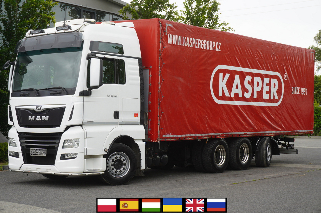 MAN TGX 35.580 E6 8x4 /4 / 23 EPAL tarp superstructure / 4th axle steered - Camion à rideaux coulissants: photos 1 MAN TGX 35.580 E6 8x4 /4 / 23 EPAL tarp superstructure / 4th axle steered - Camion à rideaux coulissants: photos 1