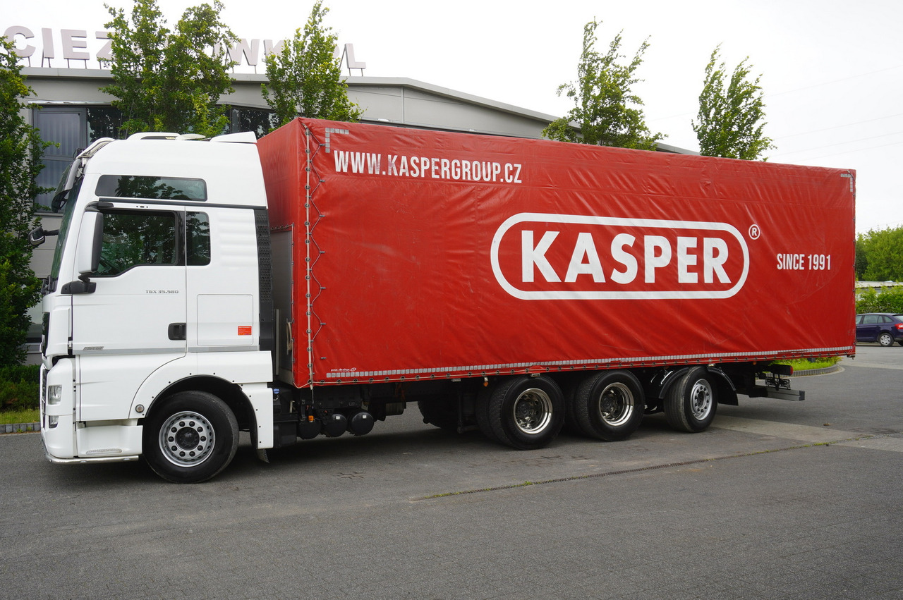 MAN TGX 35.580 E6 8x4 /4 / 23 EPAL tarp superstructure / 4th axle steered - Camion à rideaux coulissants: photos 2 MAN TGX 35.580 E6 8x4 /4 / 23 EPAL tarp superstructure / 4th axle steered - Camion à rideaux coulissants: photos 2
