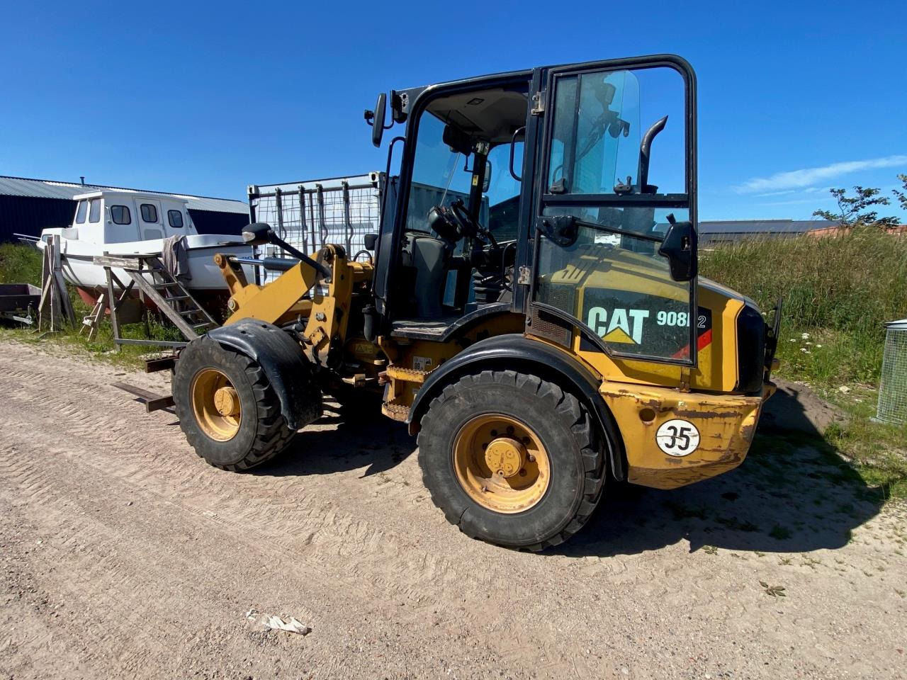 Caterpillar 908 H2 - Valet de ferme: photos 1 Caterpillar 908 H2 - Valet de ferme: photos 1