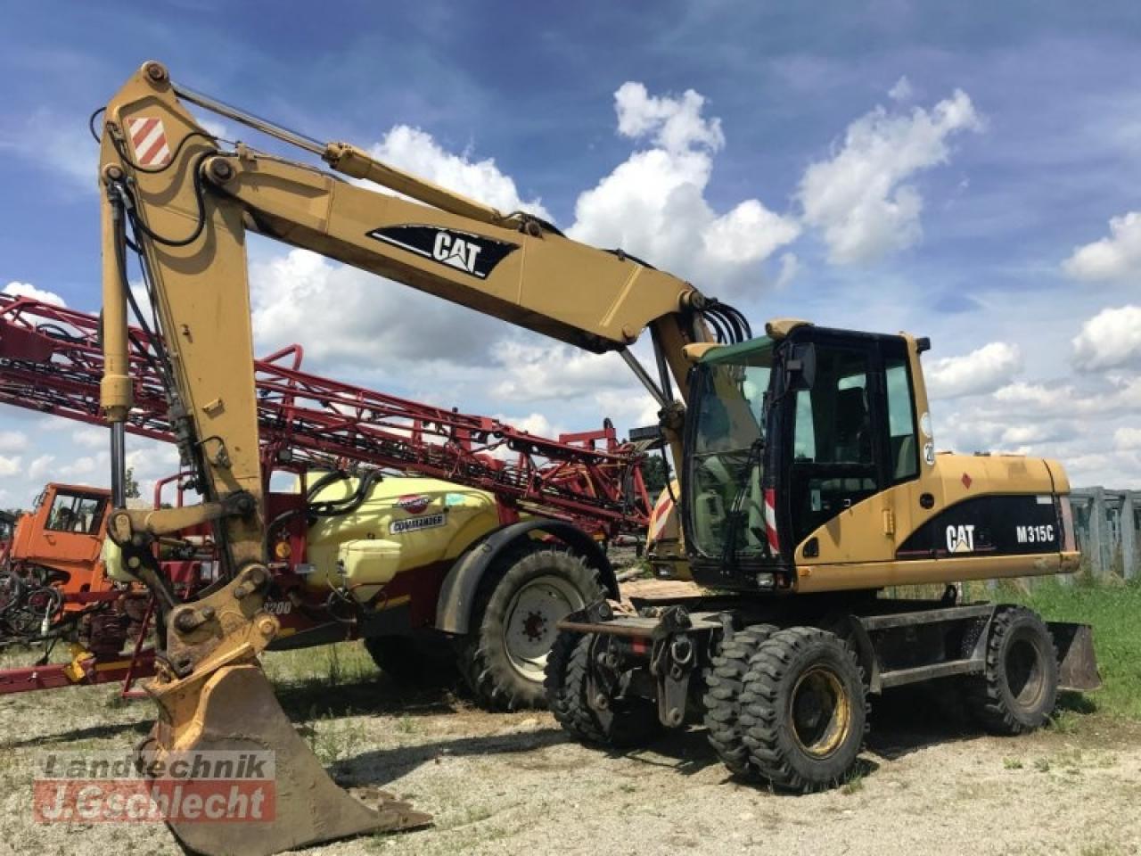 Caterpillar m 315c - Pelle sur pneus: photos 1 Caterpillar m 315c - Pelle sur pneus: photos 1