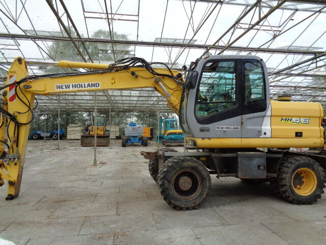 New Holland MH 4.6 - Pelle sur pneus: photos 3 New Holland MH 4.6 - Pelle sur pneus: photos 3
