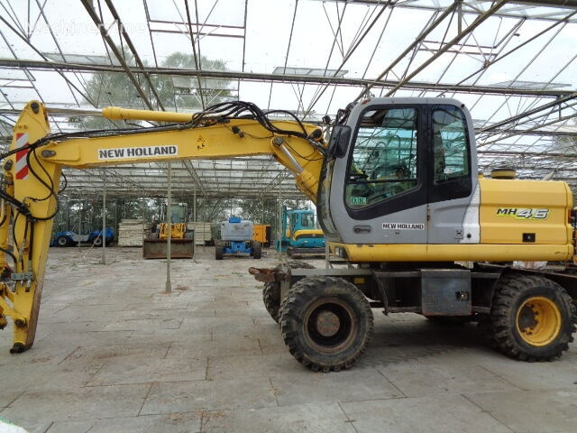New Holland MH 4.6 - Pelle sur pneus: photos 1 New Holland MH 4.6 - Pelle sur pneus: photos 1