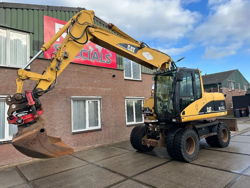 Caterpillar M315C WITH ROTOTILT, CE - Pelle sur pneus: photos 3 Caterpillar M315C WITH ROTOTILT, CE - Pelle sur pneus: photos 3