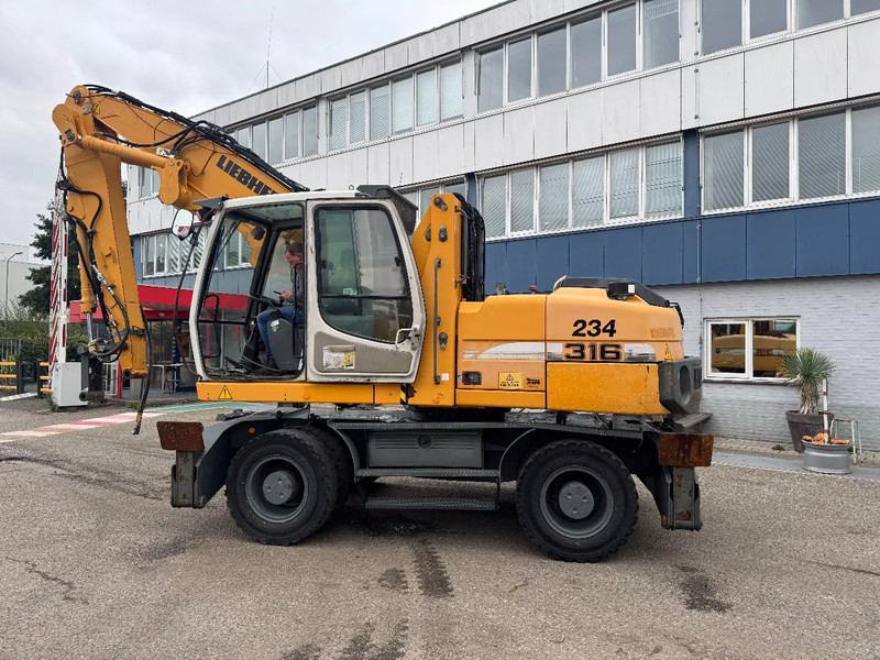 Liebherr A 316 LITRONIC CABIN HIGH CE - Pelle de manutention: photos 3 Liebherr A 316 LITRONIC CABIN HIGH CE - Pelle de manutention: photos 3