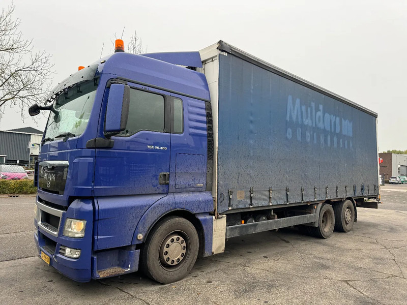 MAN TGX 26.400 6X2 - EURO 4 + LIFT + STEERING AXLE + TÜV 10-2025 - Camion à rideaux coulissants: photos 1 MAN TGX 26.400 6X2 - EURO 4 + LIFT + STEERING AXLE + TÜV 10-2025 - Camion à rideaux coulissants: photos 1