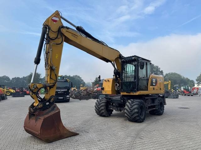 CAT M 320 F - Pelle sur pneus: photos 1 CAT M 320 F - Pelle sur pneus: photos 1
