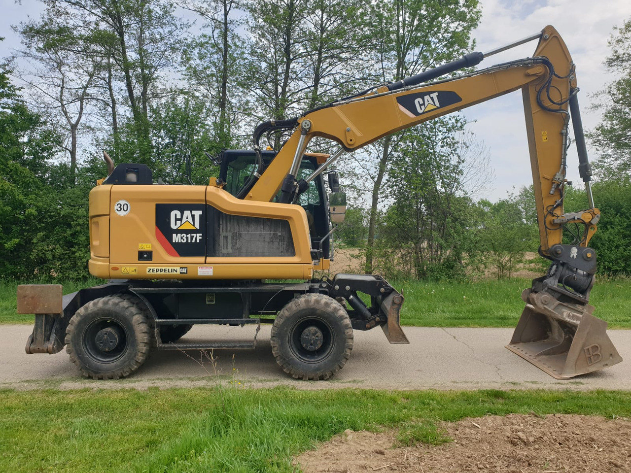 CATERPILLAR M 317 F - Pelle sur pneus: photos 2 CATERPILLAR M 317 F - Pelle sur pneus: photos 2