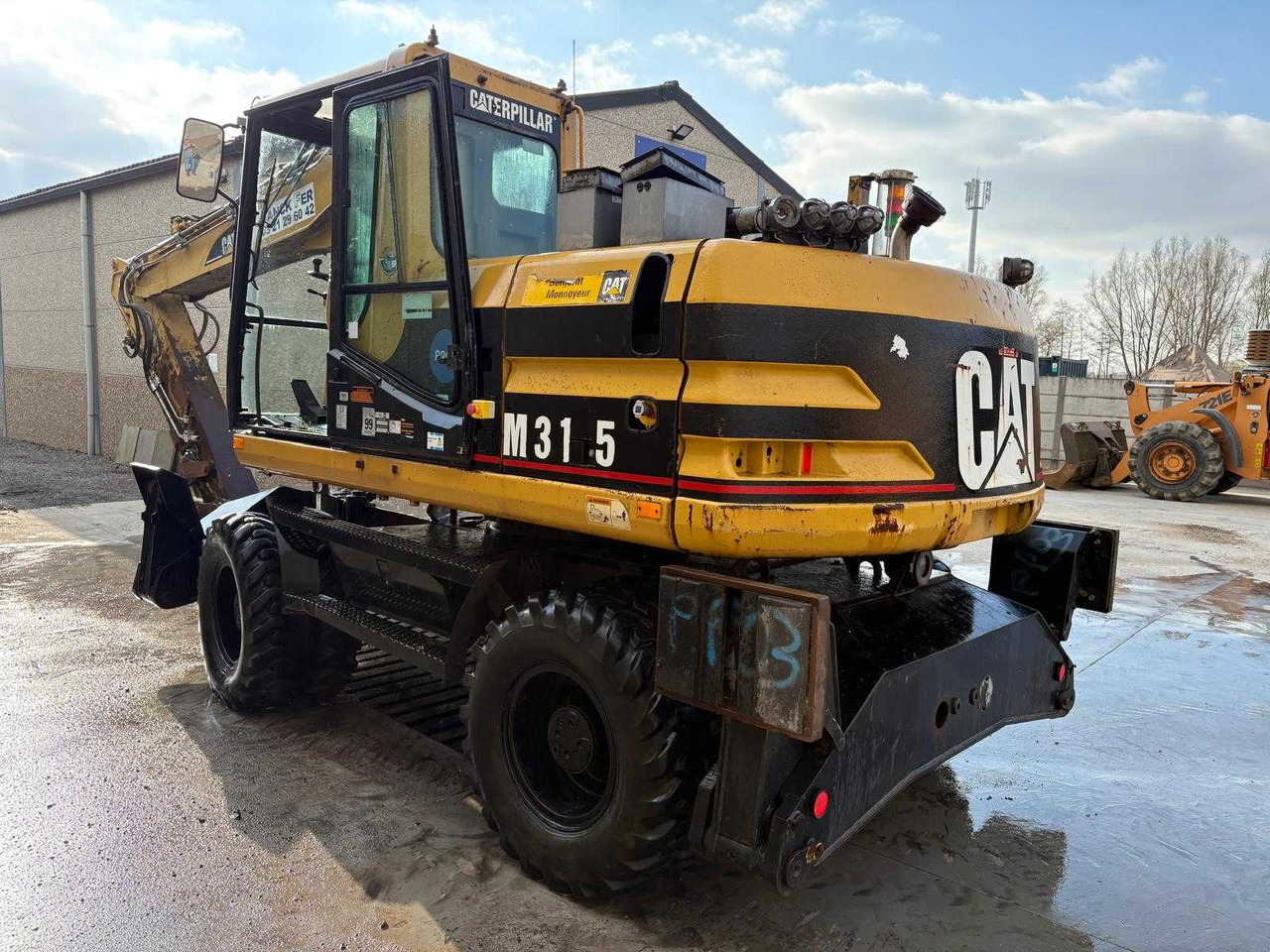 Caterpillar M315 - Pelle sur pneus: photos 2 Caterpillar M315 - Pelle sur pneus: photos 2