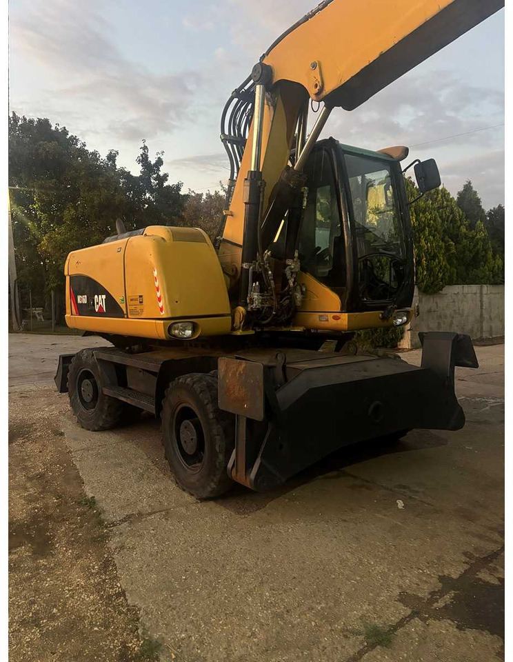 Pelle sur pneus Caterpillar M316D: photos 6