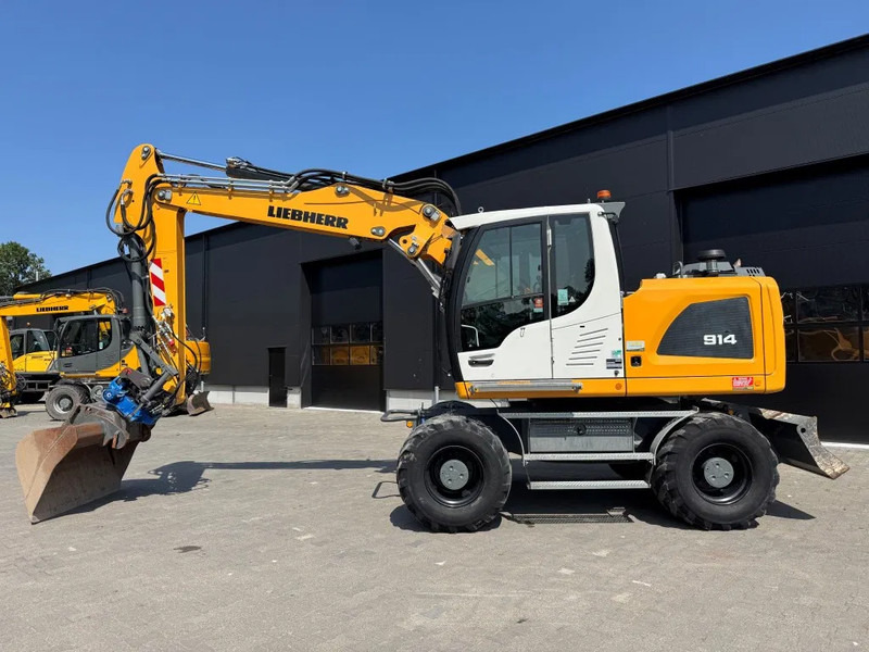 Liebherr A914 2019 7300 uur !! NL MACHINE !! - Pelle sur pneus: photos 1 Liebherr A914 2019 7300 uur !! NL MACHINE !! - Pelle sur pneus: photos 1