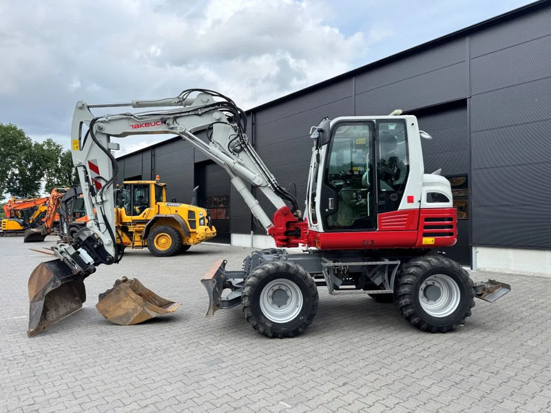 Takeuchi TB295W BJ 2021 3500 uur Compacttilt Draaikantelstuk met Gripper ! - Pelle sur pneus: photos 1 Takeuchi TB295W BJ 2021 3500 uur Compacttilt Draaikantelstuk met Gripper ! - Pelle sur pneus: photos 1
