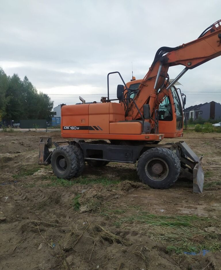 Doosan DX160 w - Pelle sur pneus: photos 5 Doosan DX160 w - Pelle sur pneus: photos 5