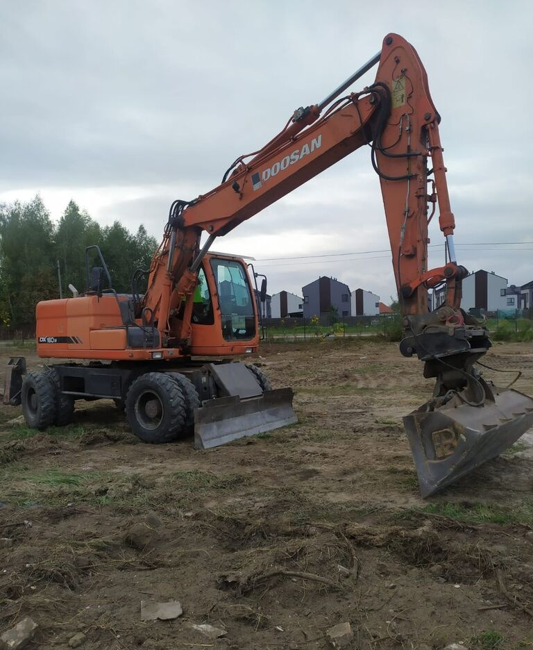 Doosan DX160 w - Pelle sur pneus: photos 4 Doosan DX160 w - Pelle sur pneus: photos 4