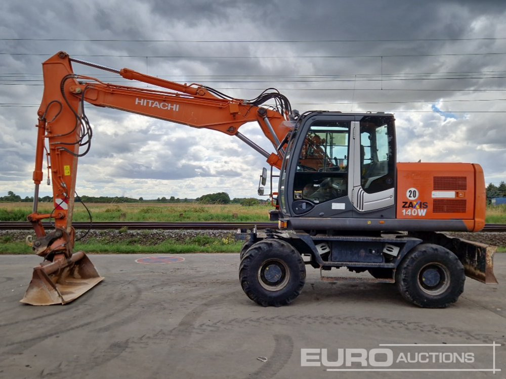 2010 Hitachi ZX140W-3 - Pelle sur pneus: photos 2 2010 Hitachi ZX140W-3 - Pelle sur pneus: photos 2